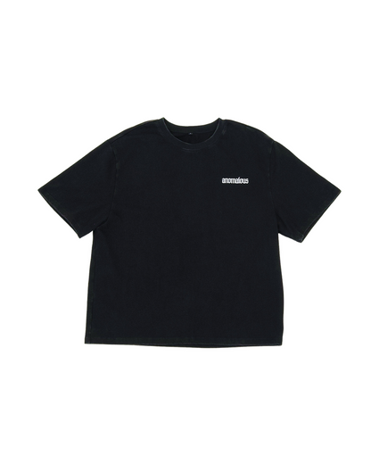 The Vessel Tee back view showing boxy fit and Anomalous lettering