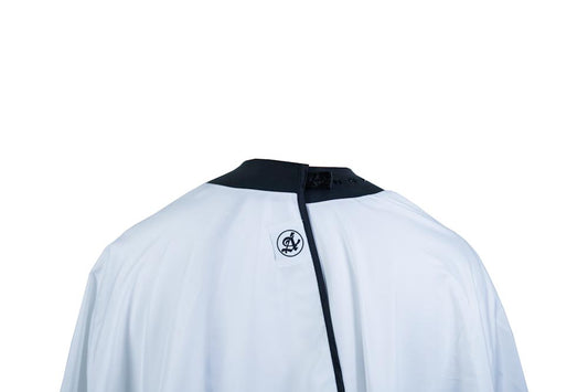 Canvas White barber cape detail showing advanced neoprene collar construction