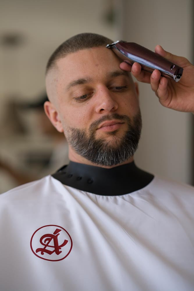 Canvas White barber cape full view showing 1.35m x 2m dimensions